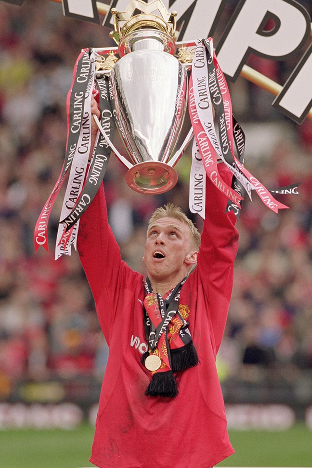 Luke Chadwick holding aloft the Premier League title he won with Manchester United in 2001