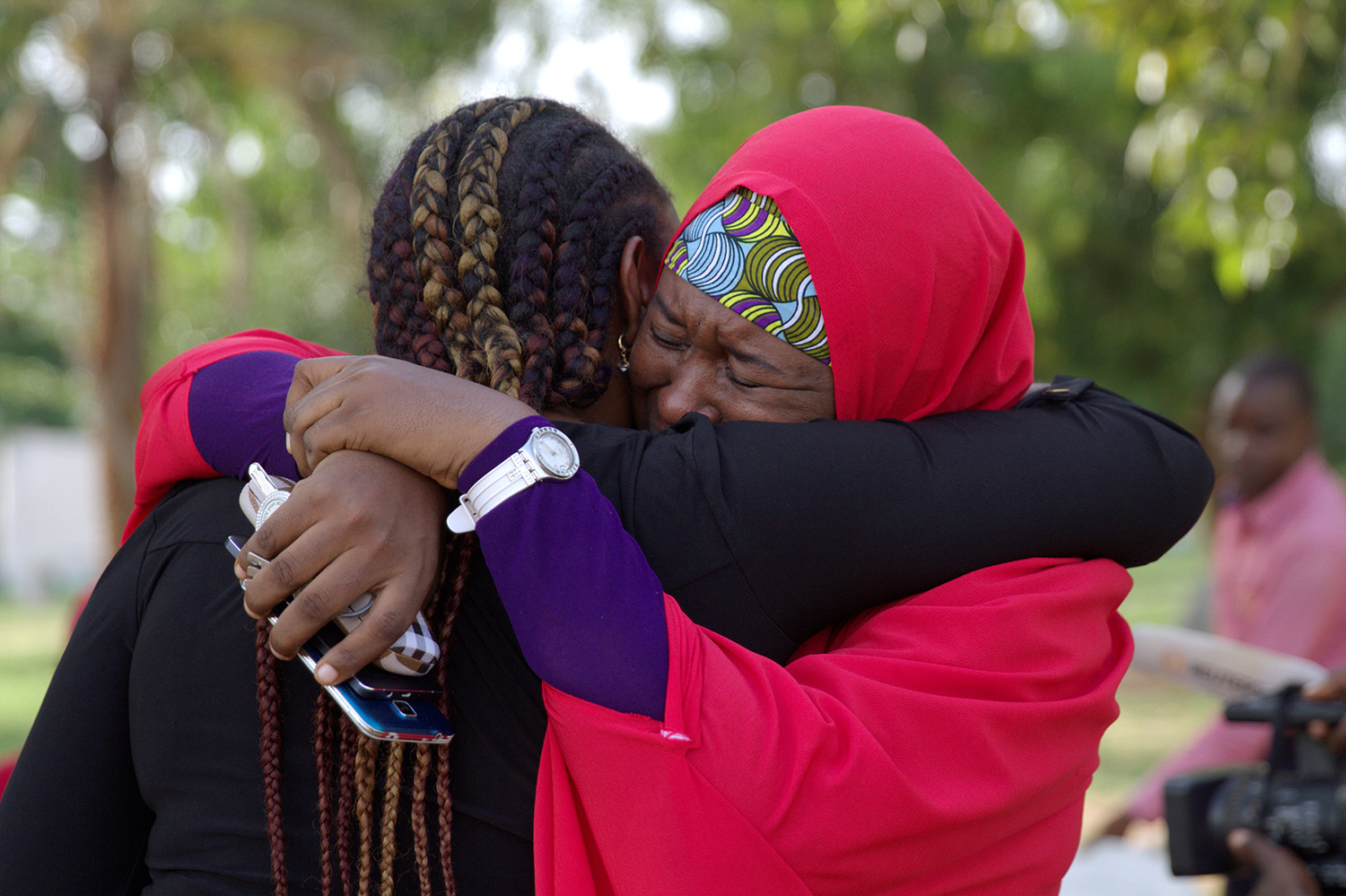 Members of the 43BringBackOurGirls (43BBOG) campaign embrace each other at a sit-out in Abuja, Nigeria May 18, 2016. A Nigerian teenager kidnapped by Boko Haram more than two years ago has been rescued, the first of more than 200 girls seized in a raid on their school in Chibok town to return from captivity in the insurgents' forest lair, officials said on Wednesday. REUTERS/Afolabi Sotunde