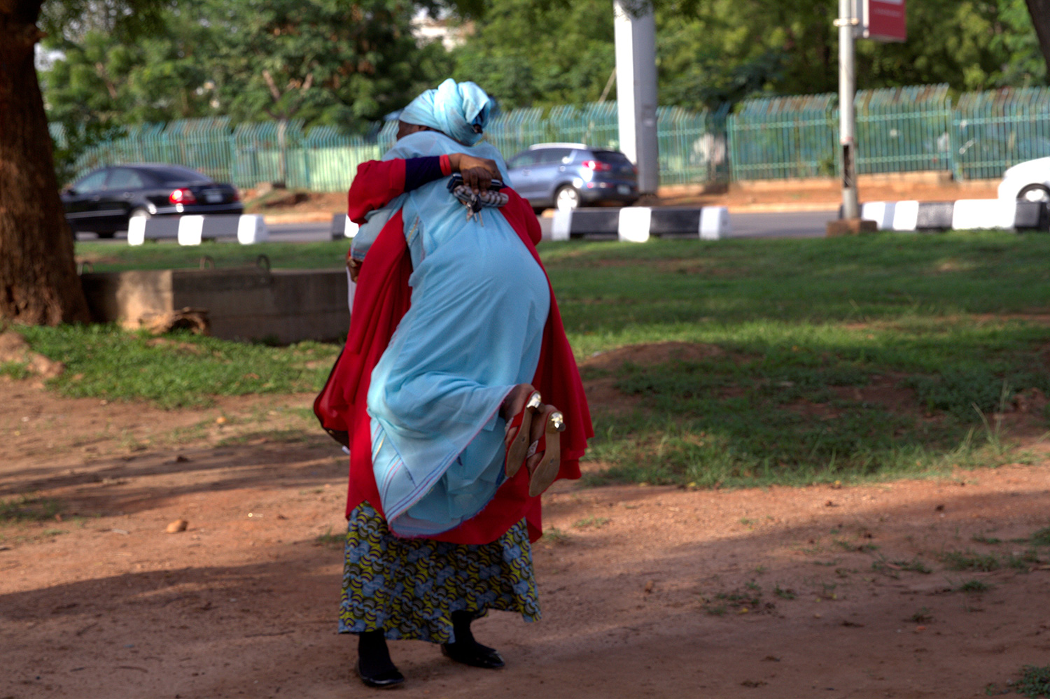 Members of the 43BringBackOurGirls (43BBOG) campaign embrace each other at a sit-out in Abuja, Nigeria May 18, 2016, after receiving news that a Nigerian teenager kidnapped by Boko Haram from her school in Chibok more than two years ago has been rescued. REUTERS/Afolabi Sotunde