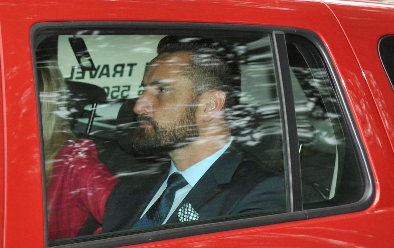 Leicester City's Polish footballer Marcin Wasilewski arrives at Peckforton Castle, Crewe, Cheshire, with his partner for the wedding of his footballing team mate Jamie Vardy.