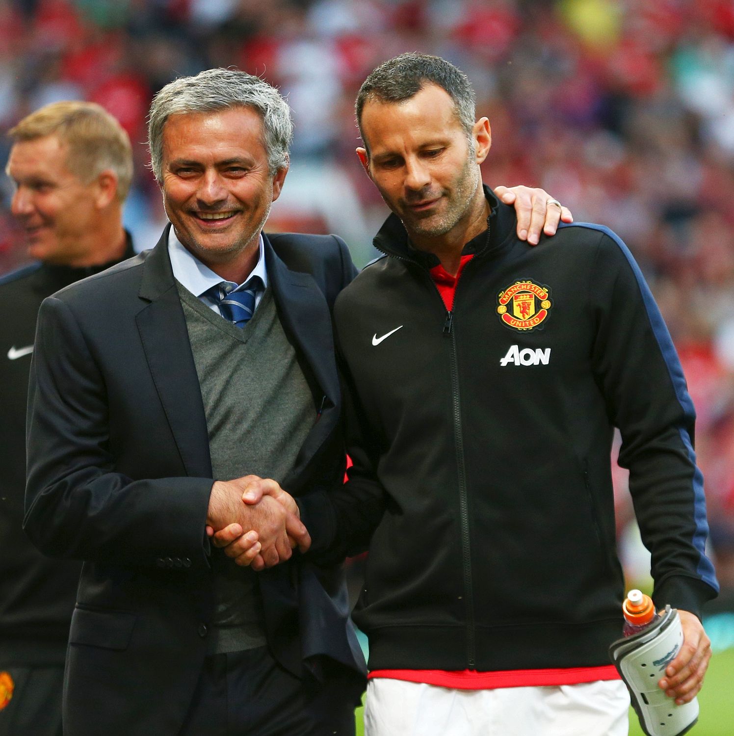 Mourinho jokes with Ryan Giggs who has yet to decide if he wants to remain as a coach at United