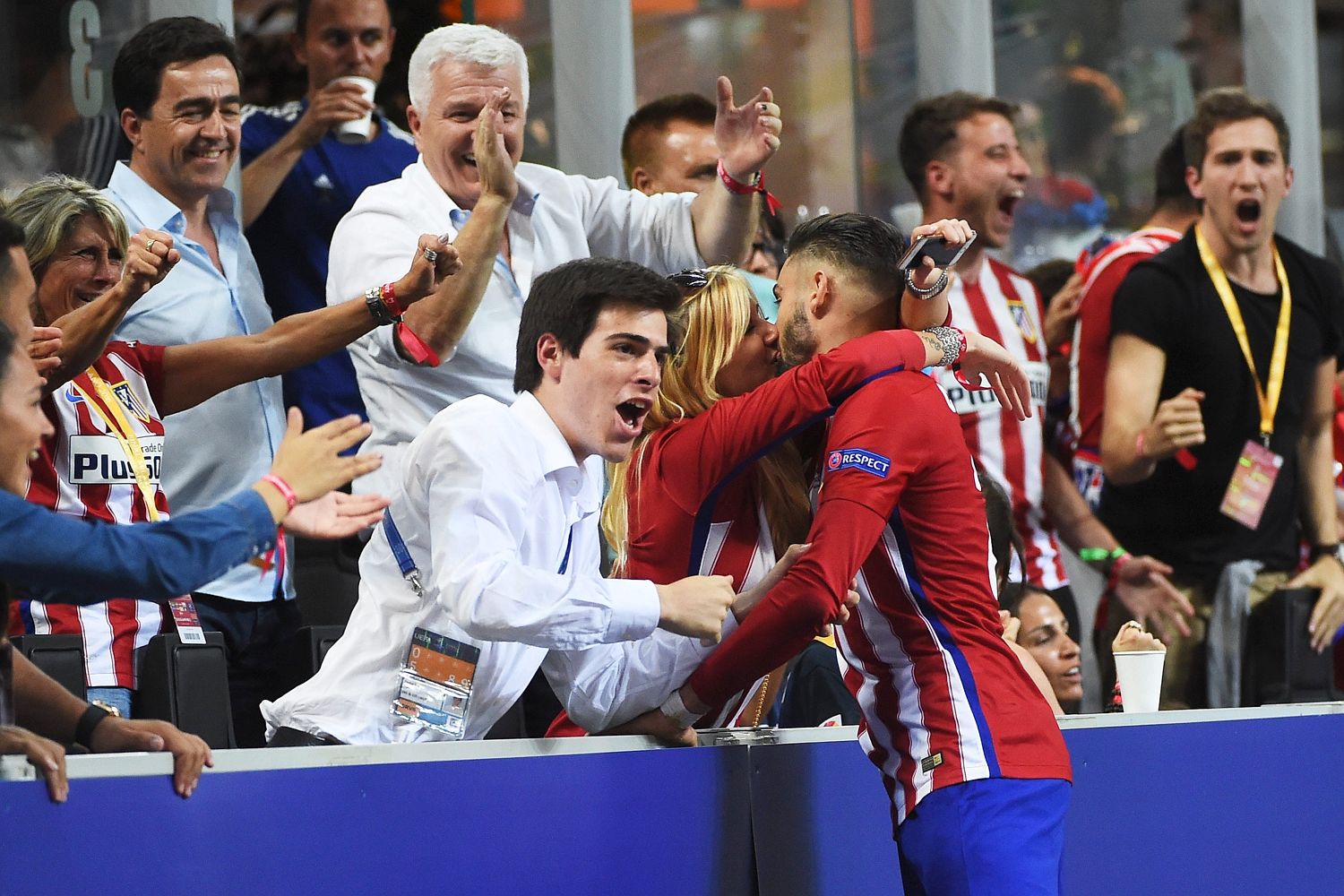 Yannick Carrasco kisses his partner Noemie Happart in the stands after scoring equaliser