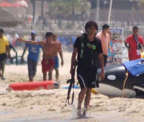  Gunman Seifeddine Yacoubi pictured strolling along the beach before gunning down scores of holidaymakers