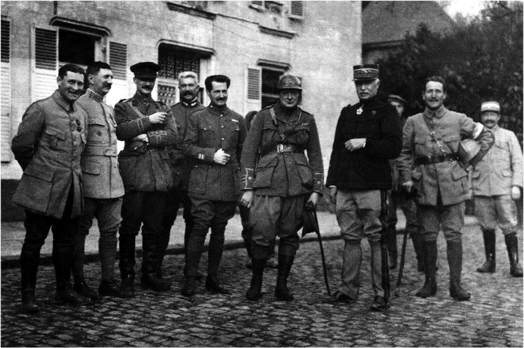  Major Winston Churchill, once again wearing his French helmet, stands with General Fayolle and other officers, including Captain Edward Spears (third from left)