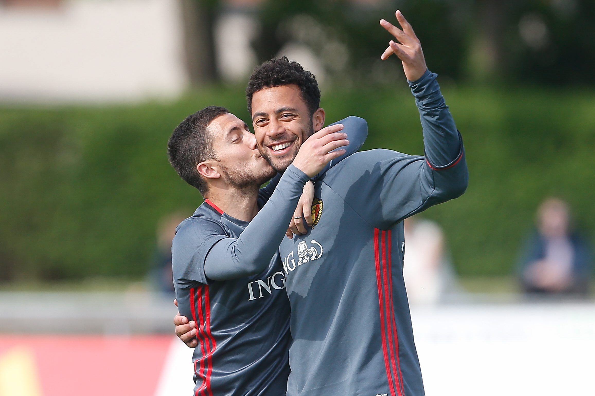  Eden Hazard gives Tottenham rival Mousa Dembele a kiss during Belgium training