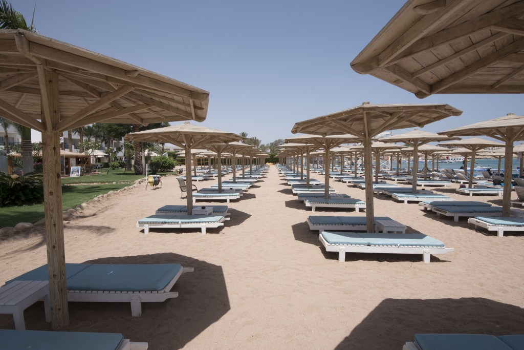 Row upon row of sun loungers lay empty on the beach yesterday as staff at seafront bars struggling to stay open implored us to come in