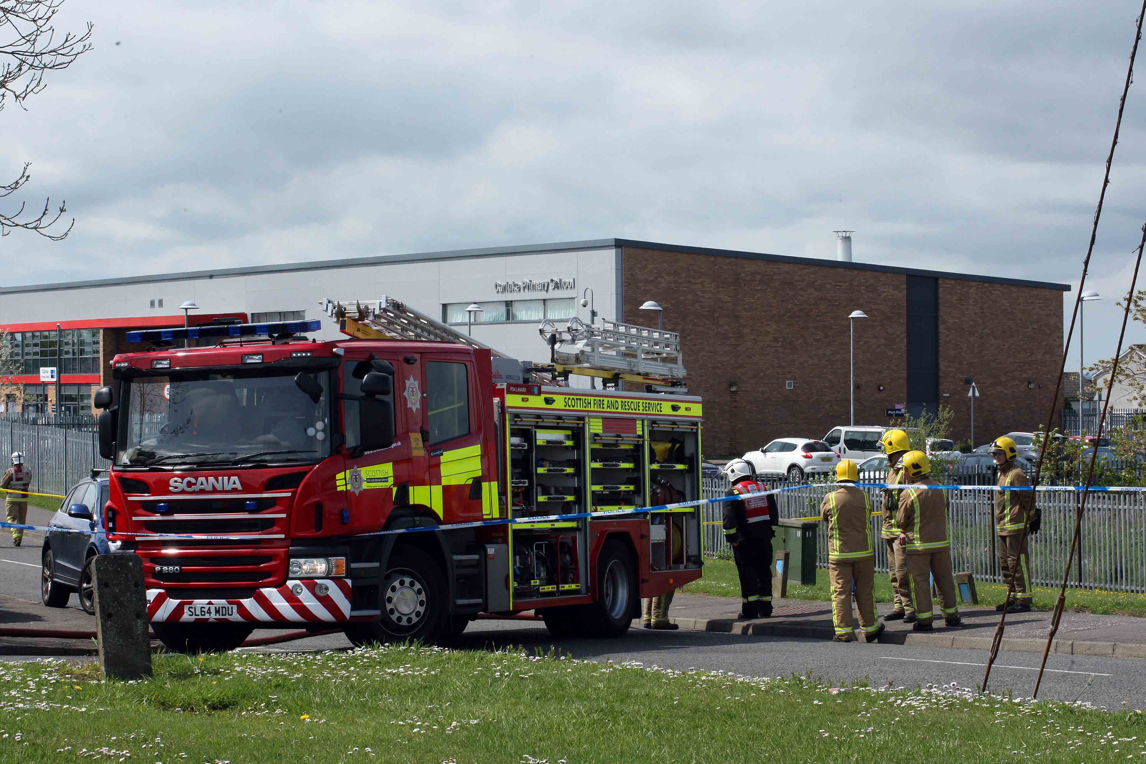  Dozens of schools received bomb threats across the UK in the past 48 hours (Pictured, emergency services outside Carluke Primary in Scotland)