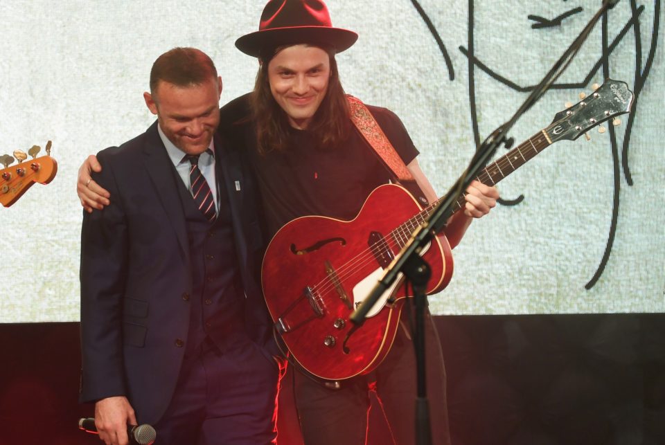  Blushing ... James Bay performs with Wayne Rooney