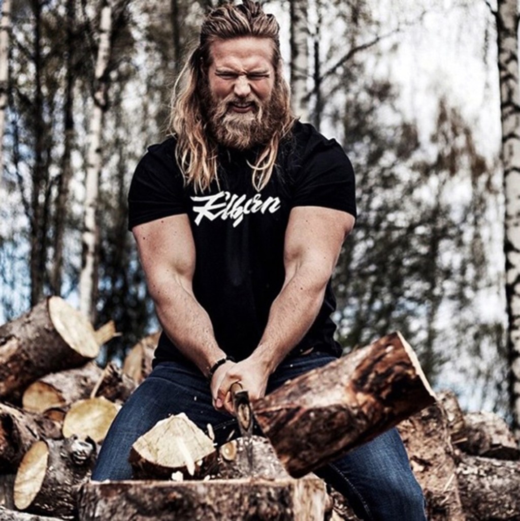  Lasse is seen chopping wood in one image that shows off his bulging biceps