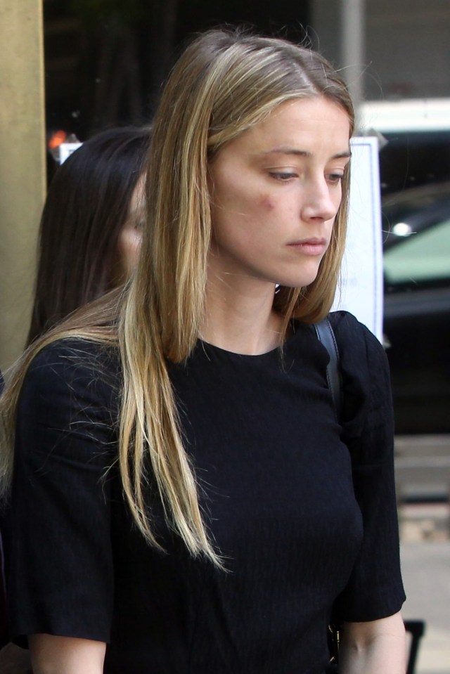  Body of evidence ... Amber Heard is accusing her 52-year-old husband of throwing a mobile phone at her face