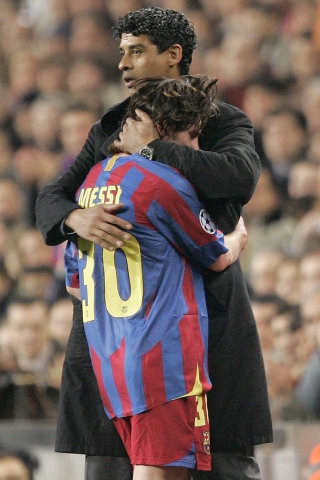  Frank Rijkaard with a young Lionel Messi, during his time as manager of Barca