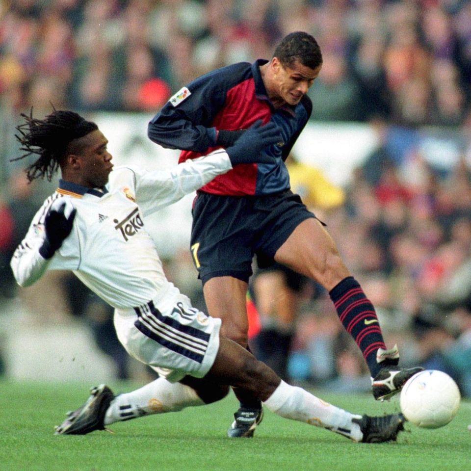  Clarence Seedorf puts a tackle in on Rivaldo during a Clasico clash in Spain