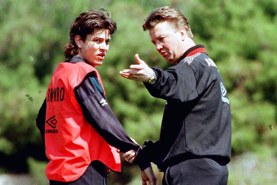  Jari Litmanen is given instructions by Ajax boss Louis van Gaal during training