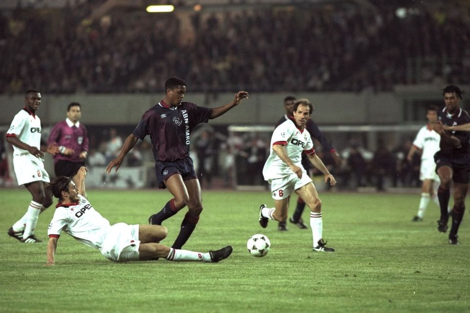  Patrick Kluivert creates some space in the AC Milan penalty area to score winner