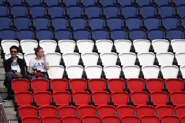  Inside the Parc des Princes stadium, things are really hotting up as a woman is forced to take her cardi off