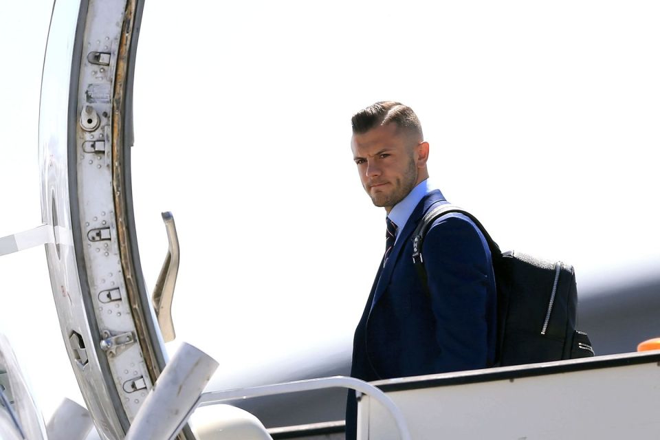  Arsenal midfielder Jack Wilshere frowns as he climbs onto the plane at Luton