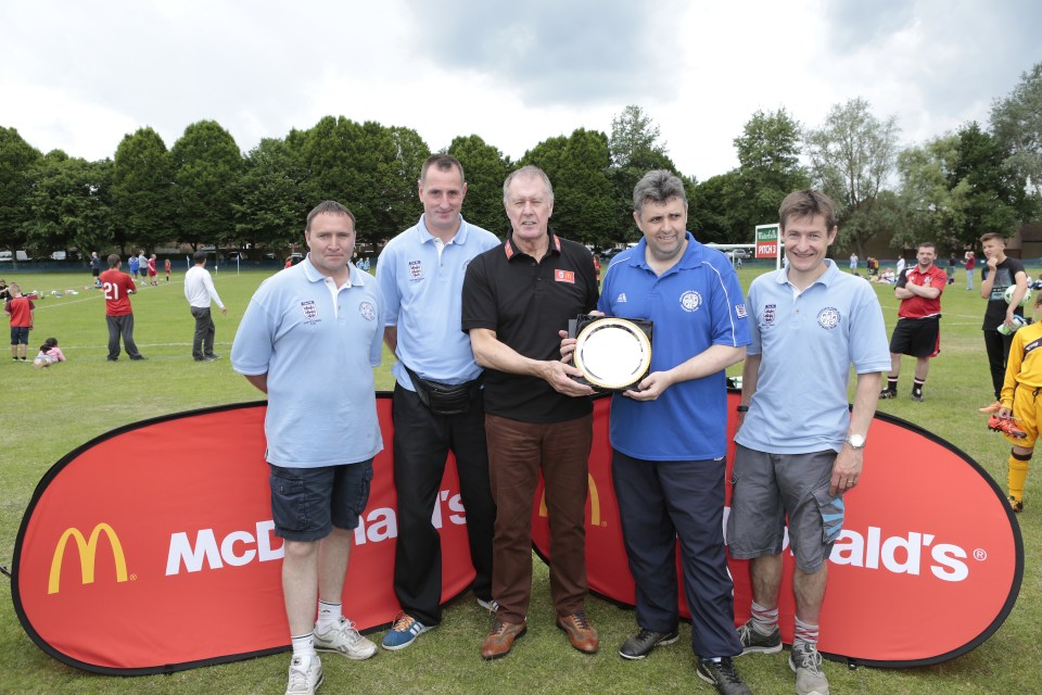  Sir Geoff Hurst who spoke exclusively to SunSport at McDonald's Community Football day, hands Lee Swain, Chairman of Goldsworth Park Rangers FC, an award