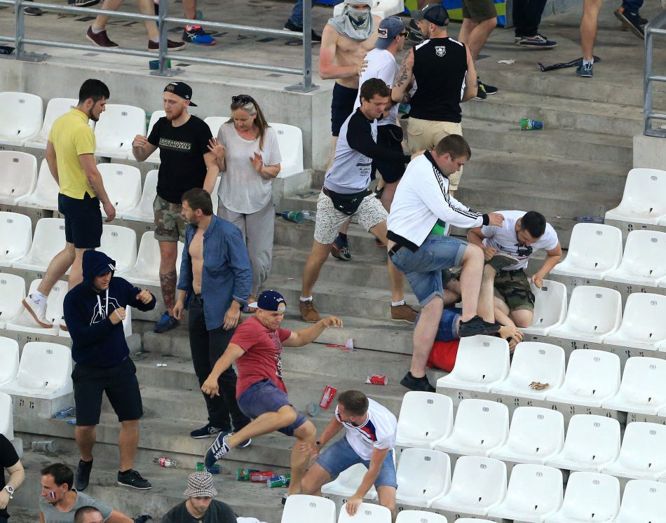 A woman try to flee as Russian fans confront England fans at the end of the match during the UEFA European Championship 2016 match at the Stade Velodrome, Marseille. Picture date June 11th, 2016 Pic David Klein/Sportimage via PA Images