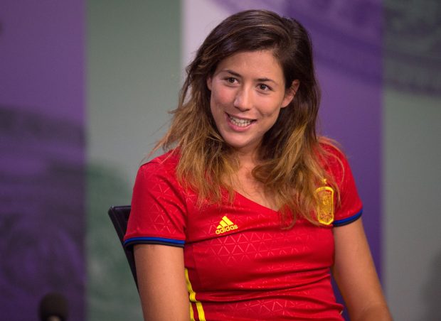 Spanish tennis star Garbine Muguruza gives her pre-Wimbledon interview in the Euro 2016 shirt of her nation