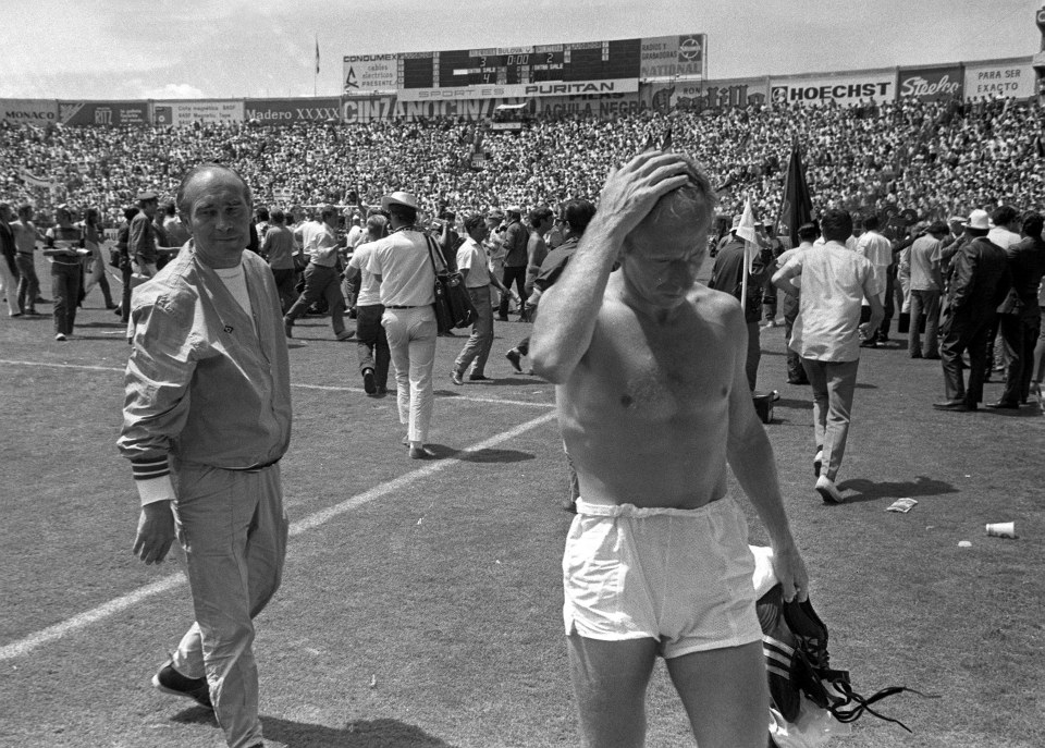  A disappointed Bobby Charlton leaves pitch after 3-2 defeat against Germany