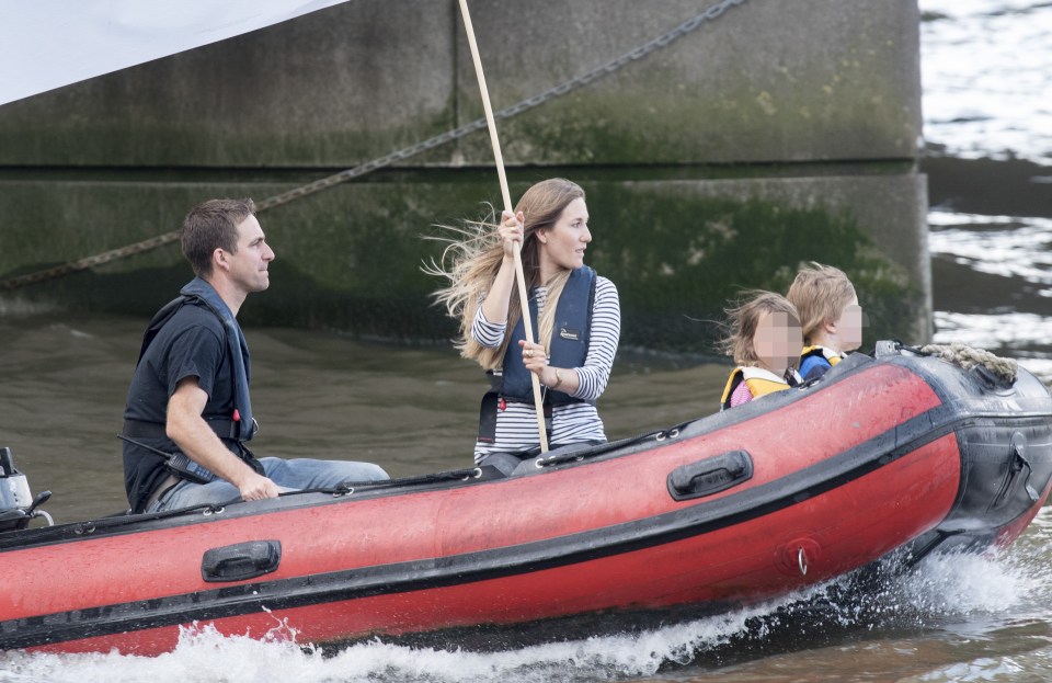  Jo Cox's husband Brendan with their children on a dinghy flying an "In" flag at the trawler Leave protest on the Thames on Wednesday