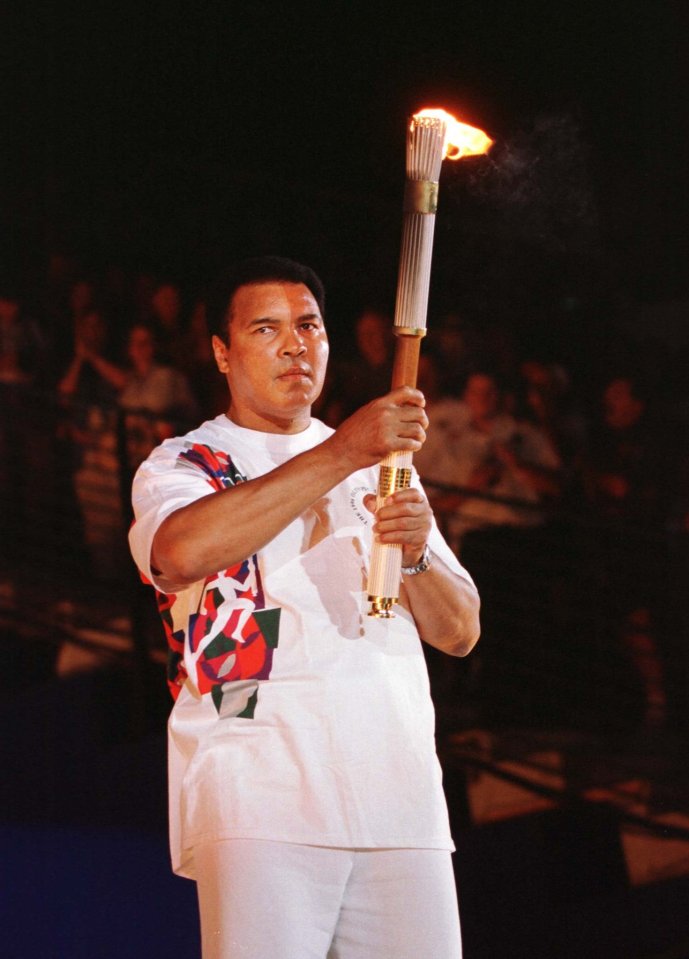  Olympic icon ... Ali carries sporting flame at Atlanta 1996