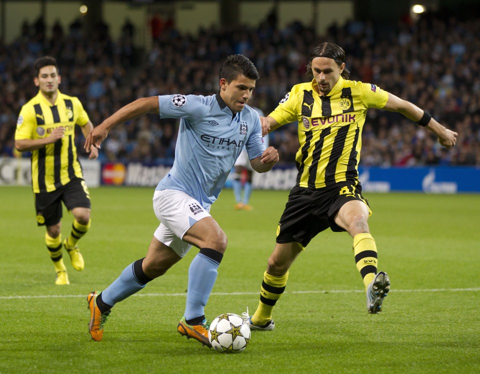  Subotic tries to halt the run of Sergio Aguero in a Champions League clash