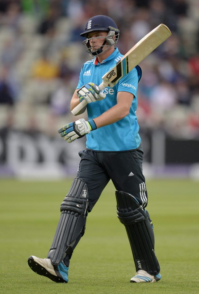  Jos Buttler swipes his bat as he walks off furious with the dismissal