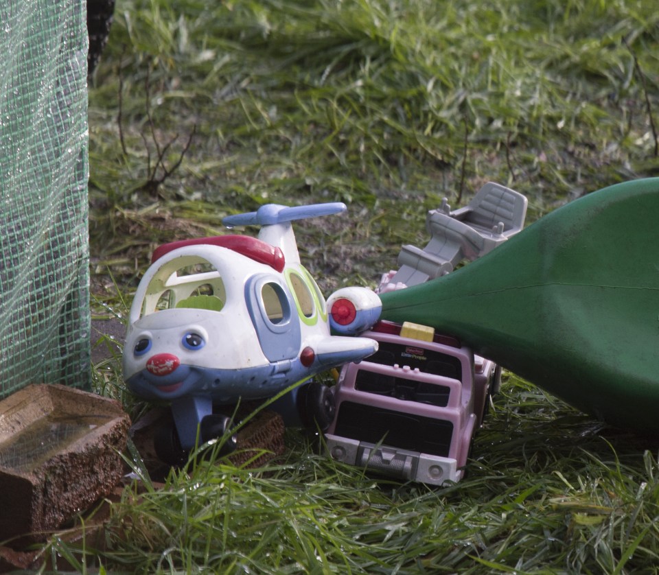  Kids toys and garden tools were strewn around the area where the bodies were uncovered