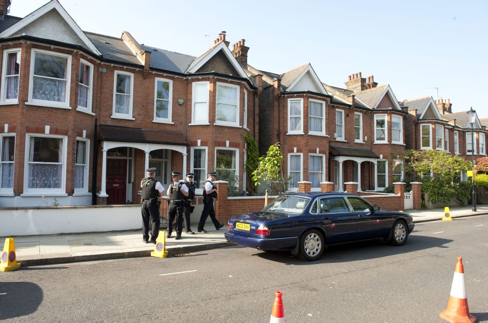  Cops stand guard over the Camerons' Notting Hill home which they have spent £600,000 transforming