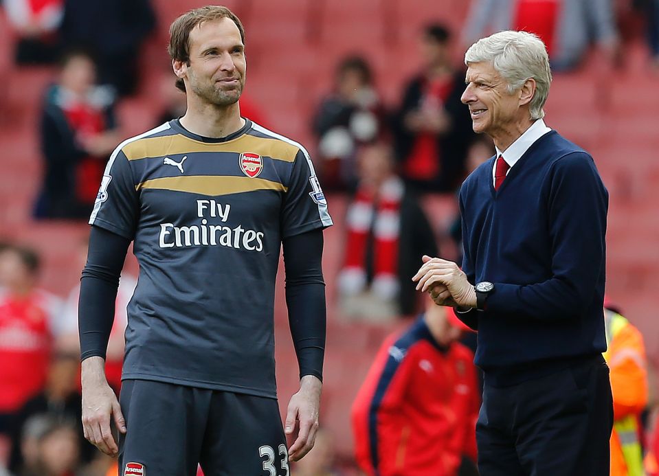 Petr Cech speaks with Arsenal manager Arsene Wenger after the Gunners final game of the season