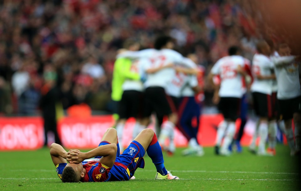  Dwight Gayle lies dejected on the floor after Crystal Palace's FA Cup final defeat by Manchester United last month at Wembley Stadium