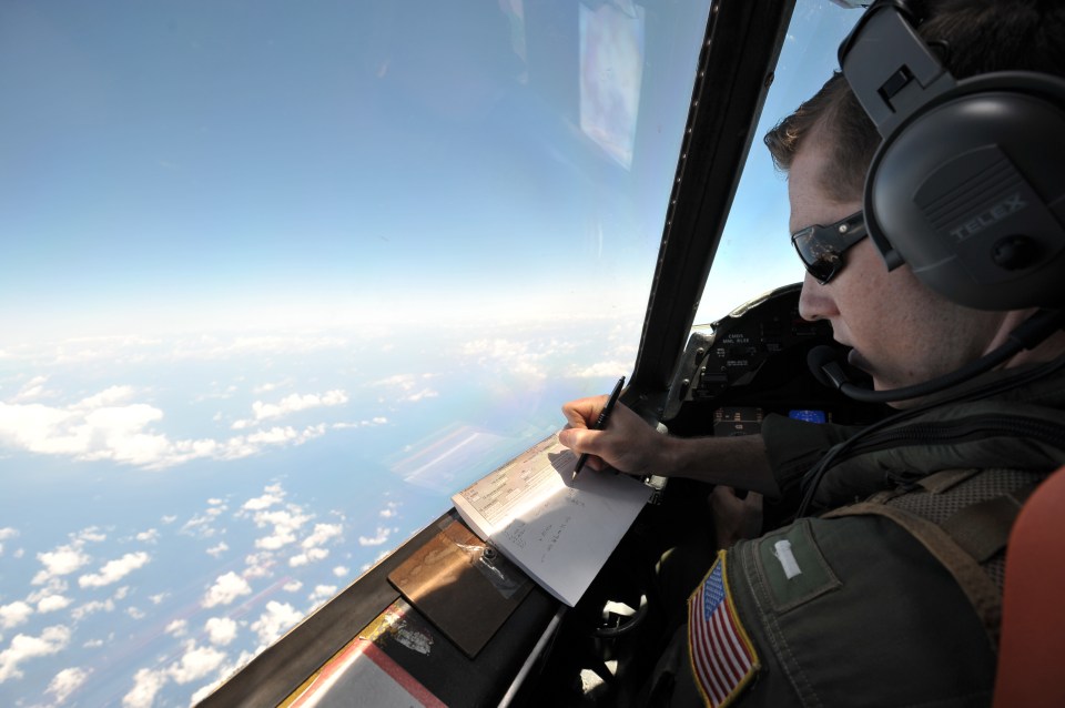 U.S. Navy LT JG Curtis Calabrese takes notes on board of a U.S. Navy Lockheed P-3C Orion patrol aircraft from Sigonella, Sicily, Sunday, May 22, 2016, searching the area in the Mediterranean Sea where the Egyptair flight 804 