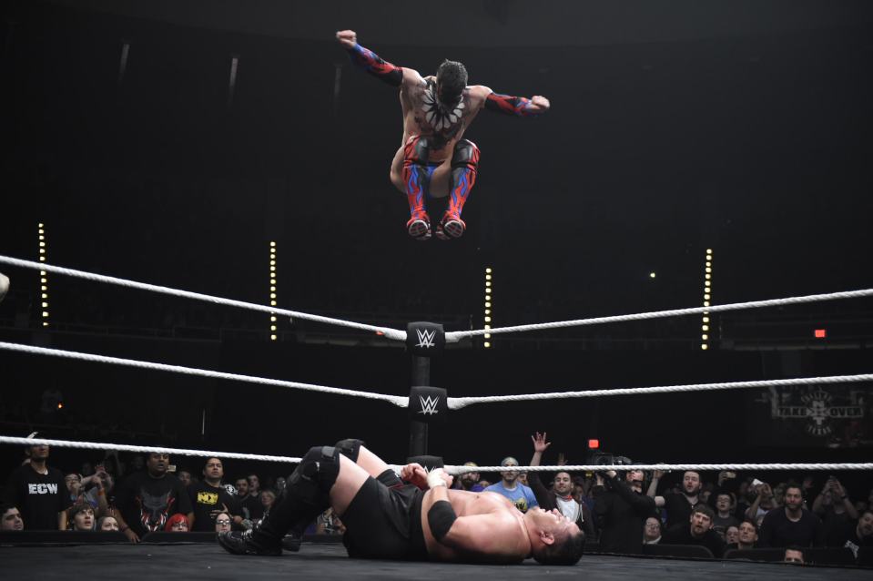  Finn Balor launches himself off the top NXT turnbuckle at a stranded Samoa Joe