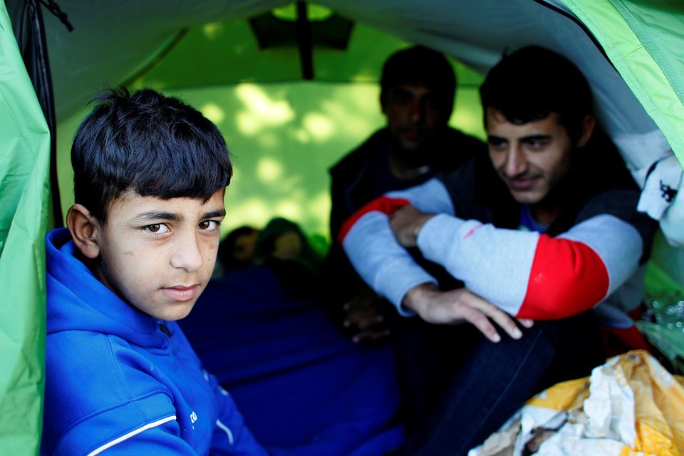  Refugees from Afghanistan sit in a tent before they are made to move on. Those living in the area ranged from children to the elderly