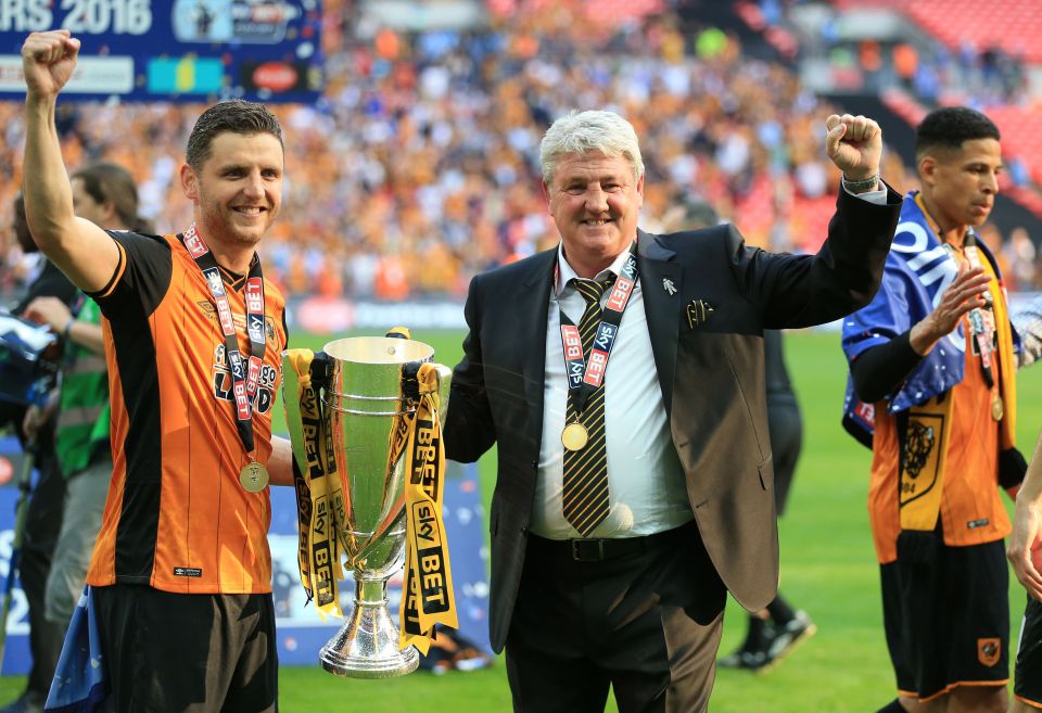 Hull City manager Steve Bruce and his son Alex after the play-offs