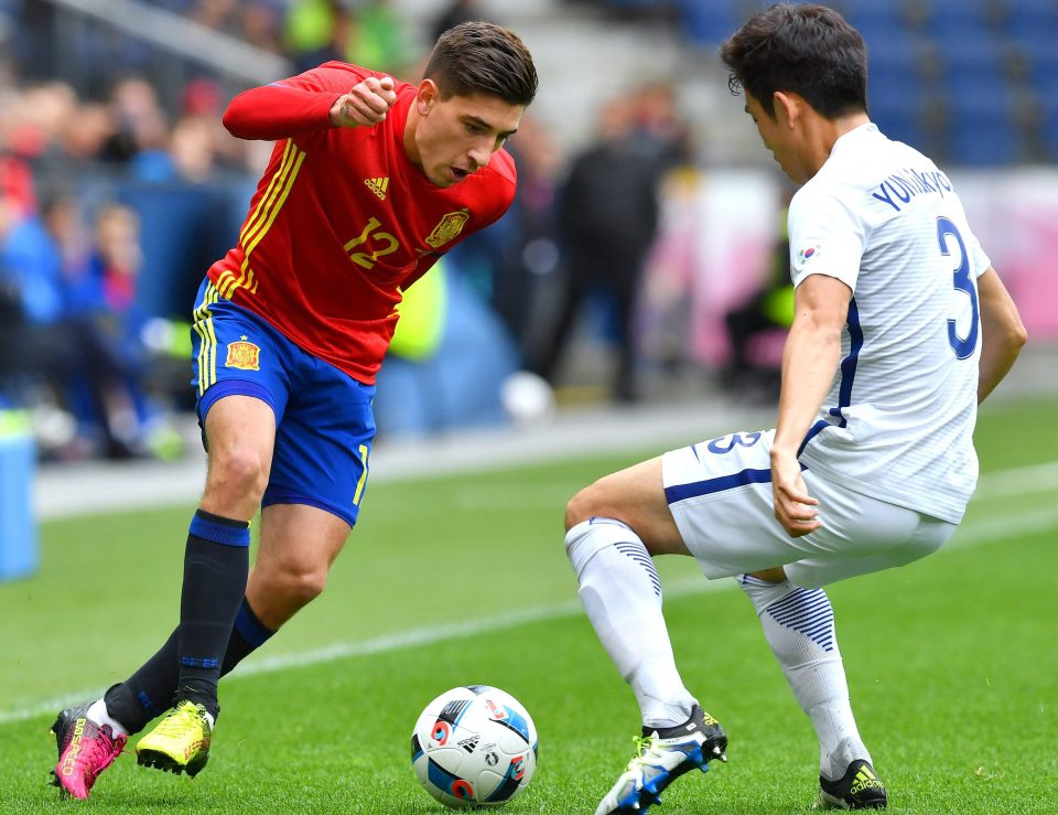  Spain's Hector Bellerin and South Korea's Sukyoung Yun vie for a ball during a friendly in the build-up to Euro 2106 where the Arsenal man looks sure to impress