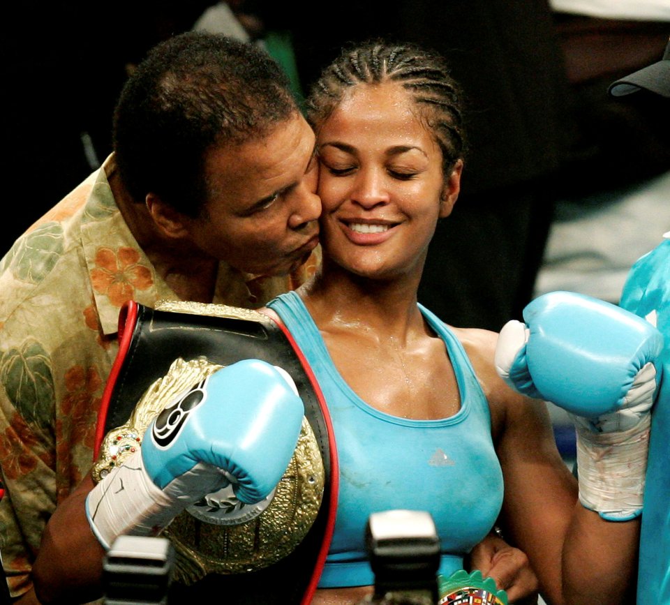  WBC and WIBA super middleweight champion Laila Ali is kissed by her father