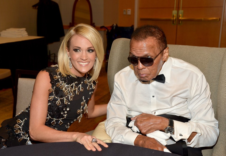  The final picture of The Greatest was taken with Celebrity Fight Night Award honoree Carrie Underwood (L) at Muhammad Ali's Celebrity Fight Night XXII in Arizona