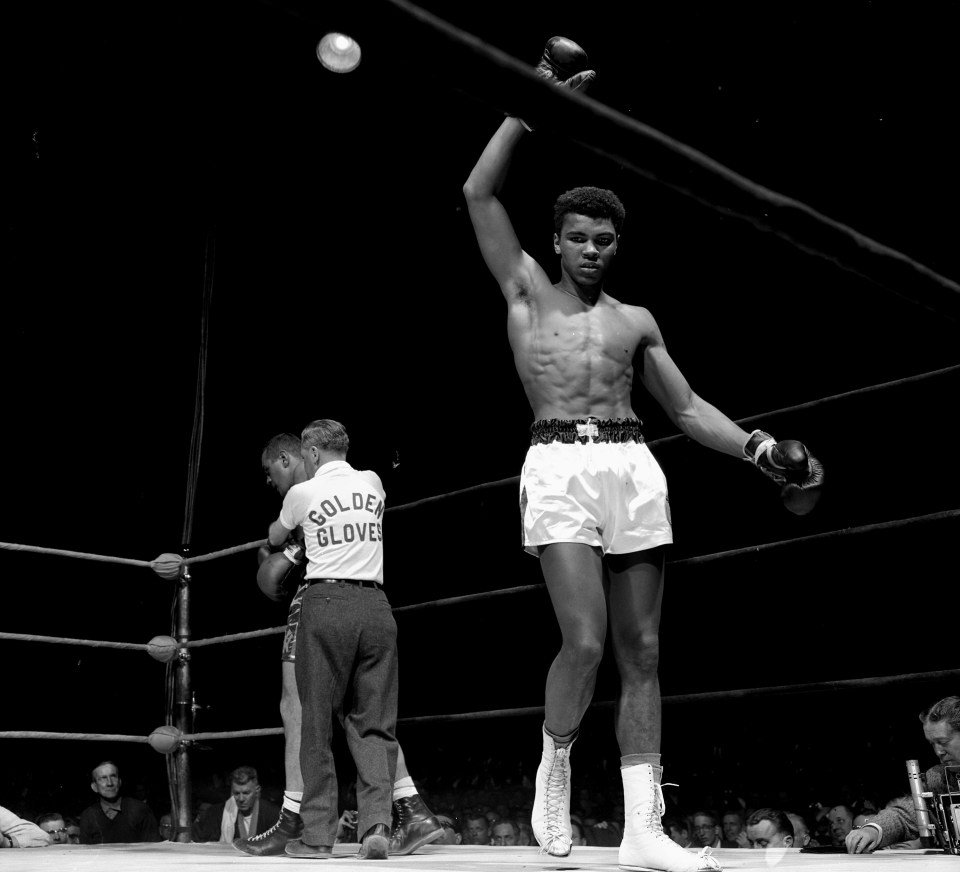  Eighteen-year-old Cassius Clay (Muhammad Ali) raises his arm in victory after knocking out Gary Jawish in the 1960