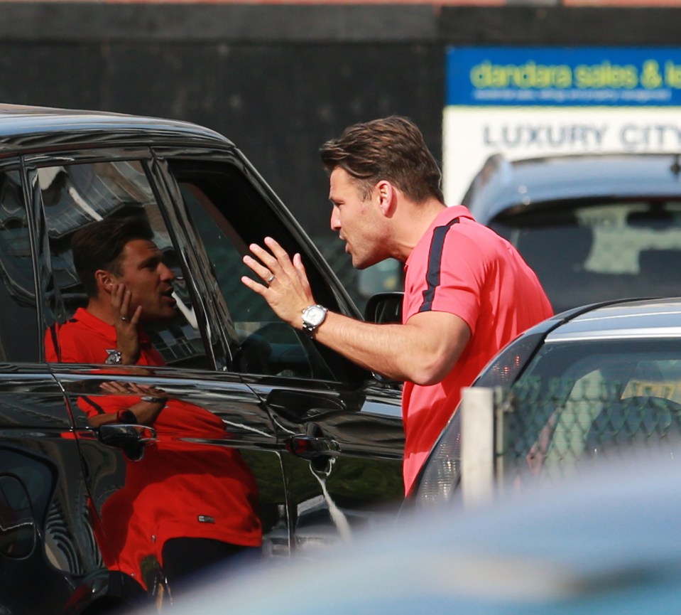  They looked like they were having a row when Michelle arrived in Manchester