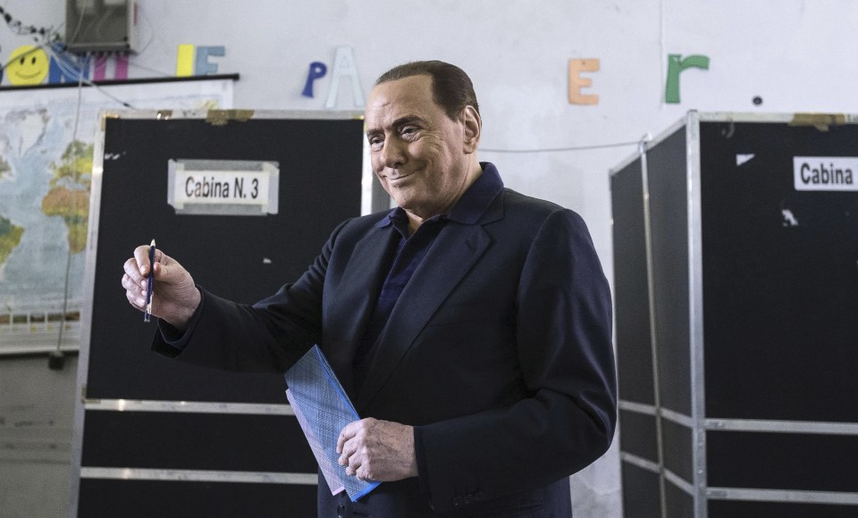  Former Italian Premier Silvio Berlusconi casts his ballot in Rome, on Sunday - shortly before he went into hospital