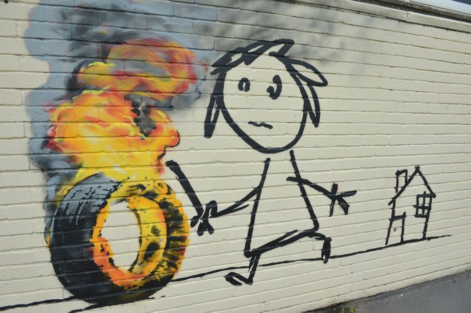 The 14ft piece, showing a child with a stick chasing a burning tyre, was discovered at Bridge Farm Primary in Bristol 