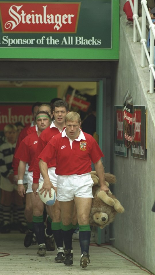  Peter Winterbottom of British and Irish Lions leads team out with toy