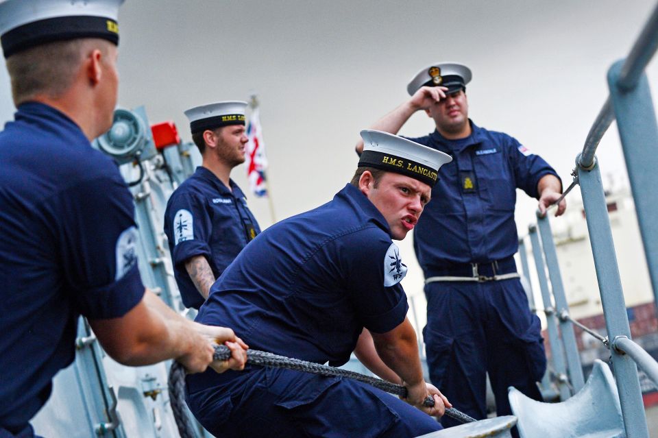  This image shows AB Harry Hickman working on board HMS Lancaster with other crew members, taken by Will Haigh