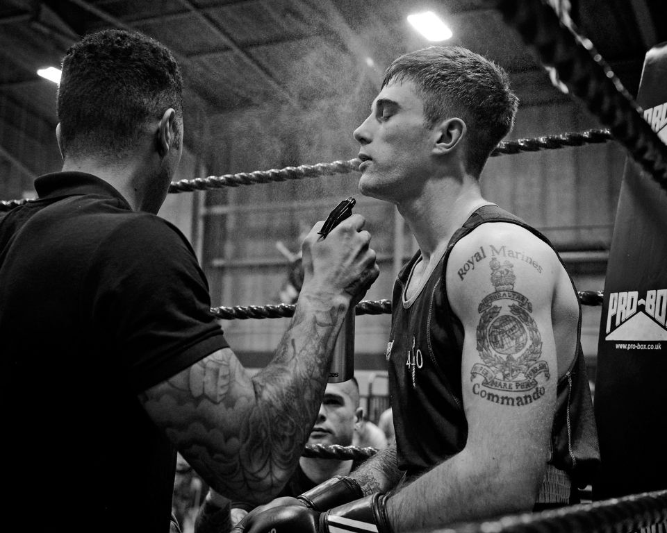  Matthew Farran of 40 Commando Royal Marines, composes himself before the third and final round of the Light Welterweight final - captured by Will Haigh who won the Royal Navy Photographer of the Year