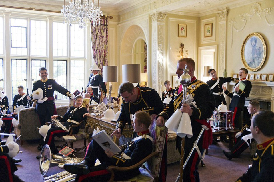  Marine band members take a break from playing a range of instruments including trombones, clarinets and drums in a luxurious room