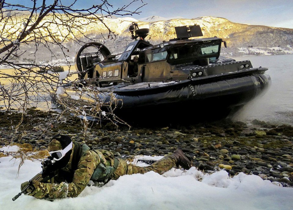  The cold is evident as a member of 539 Assault Squadron takes up position on the icy shores of a Norwegian fjord during a beach assault exercise