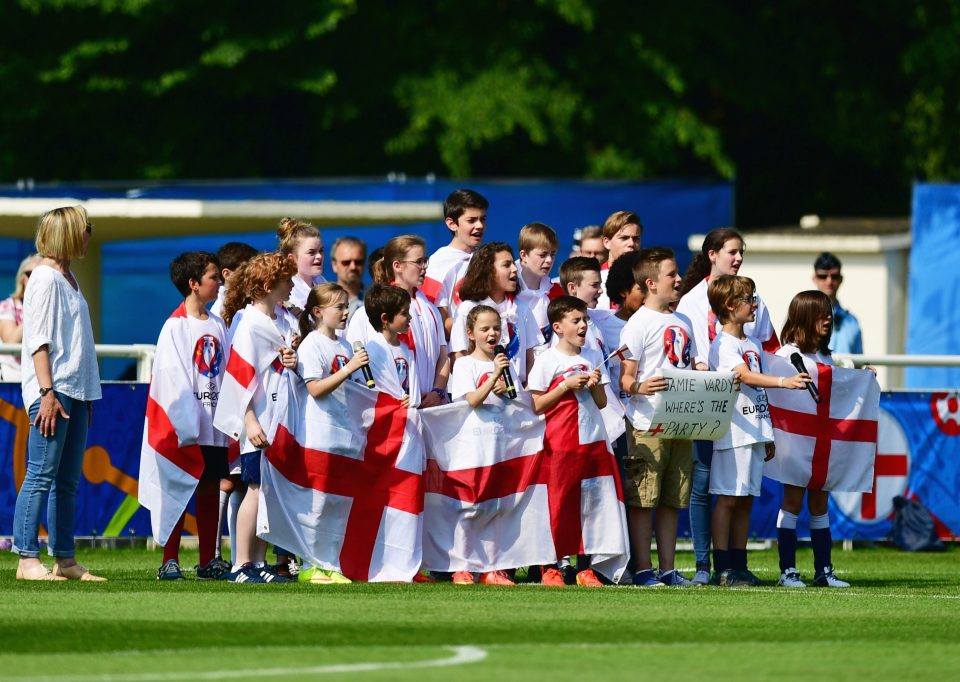  Children sing the national anthem as players are welcomed during the England training session at the Stade des Bourgognes in Chantilly