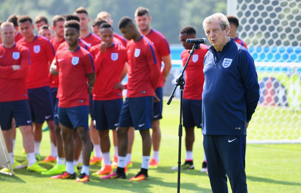 The England squad look on as Roy Hodgson addresses the crowd in French during England;s open training session